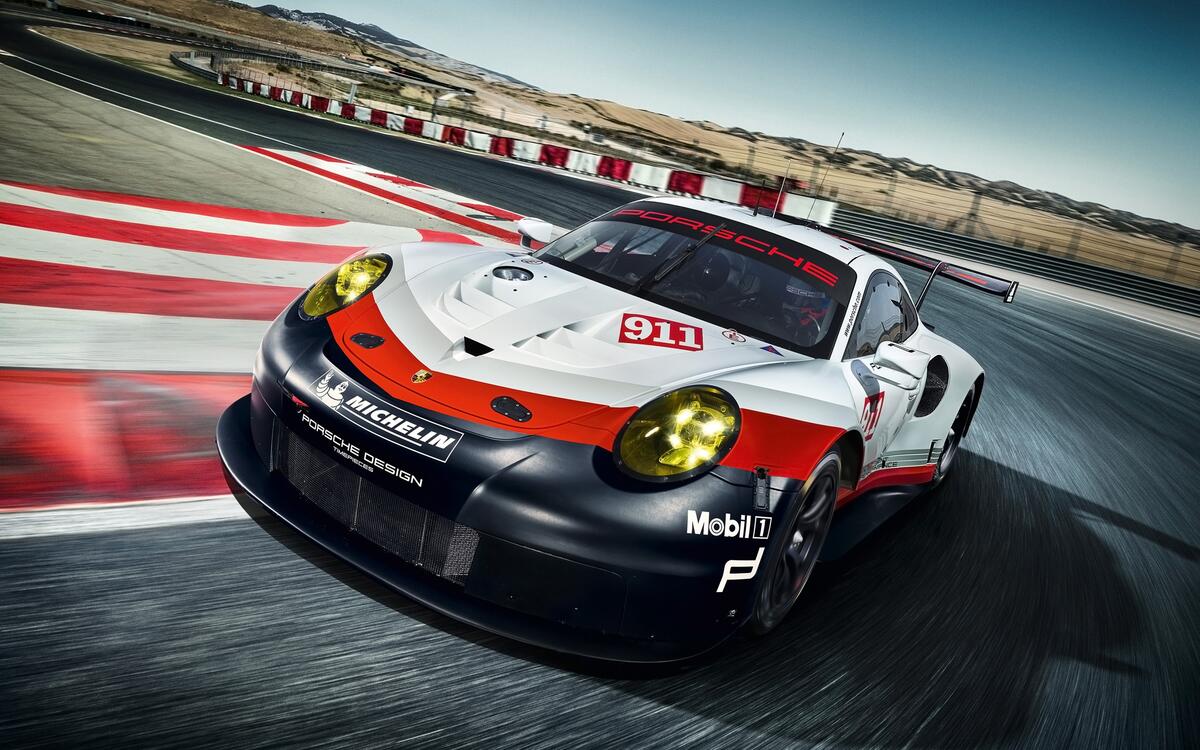 Porsche 911 rsr on a closed circuit race track