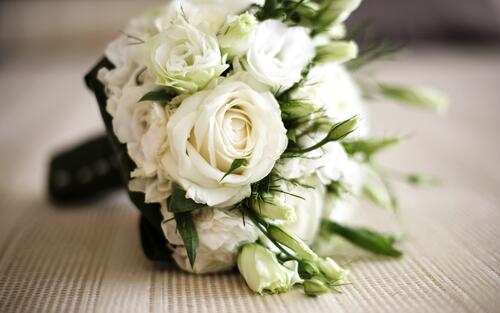 Picture of a wedding bouquet of white roses