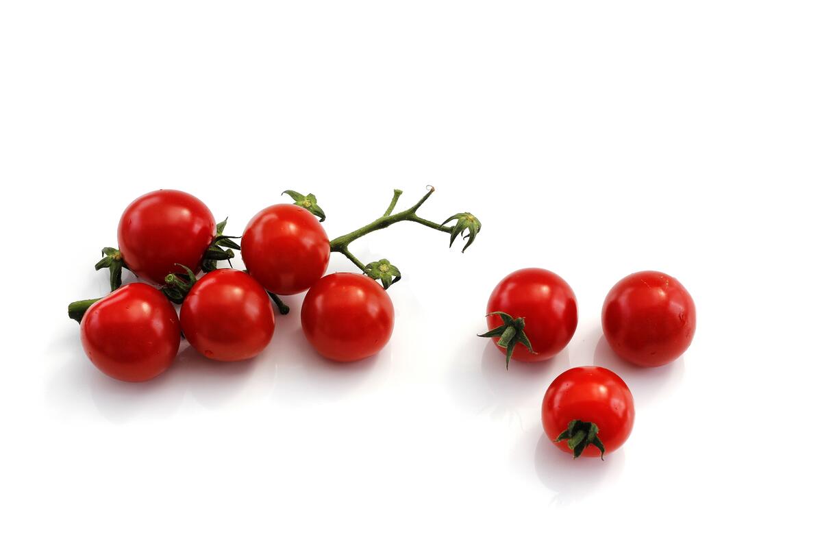 Small cherry tomatoes on a white background