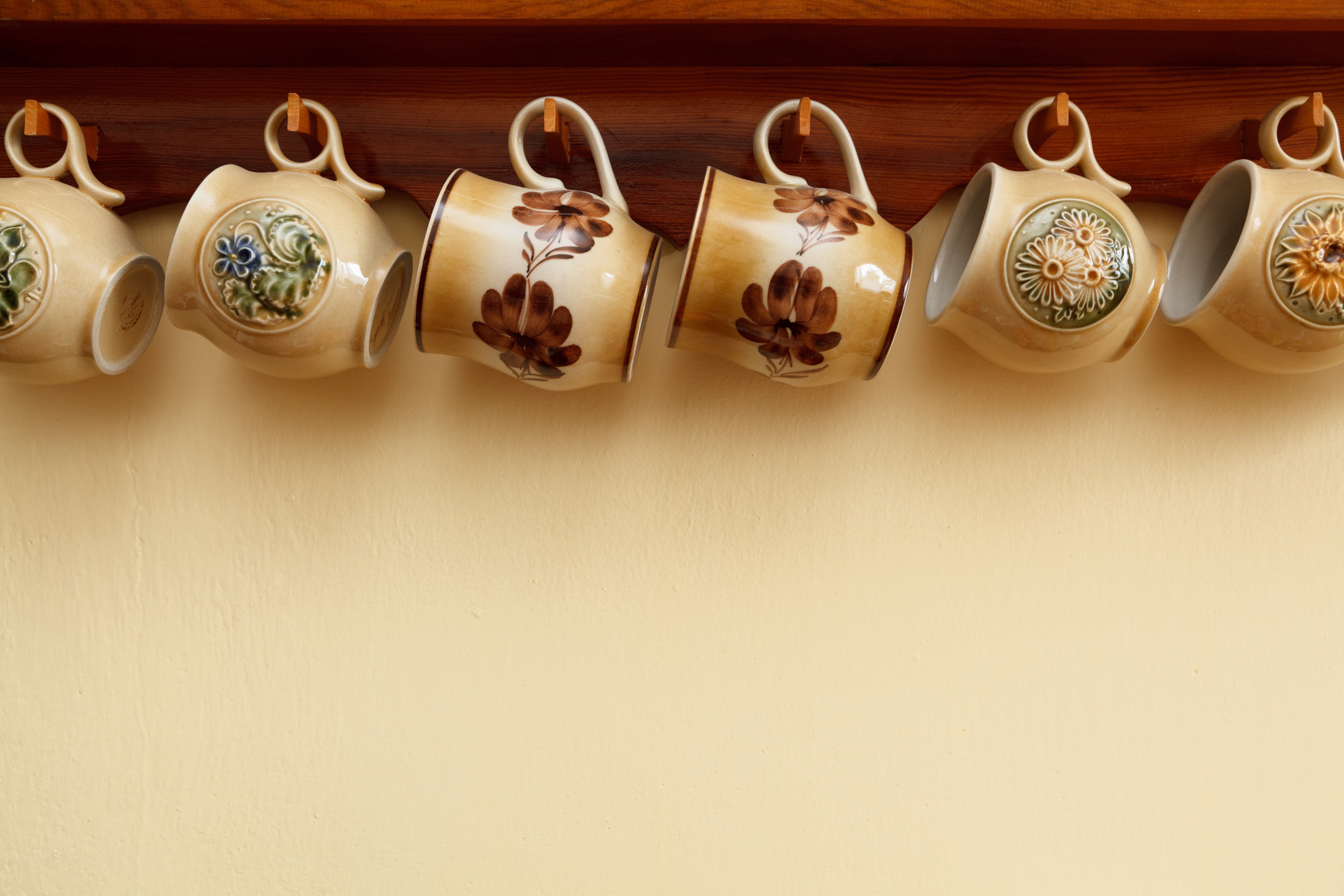Tea mugs hung by their handles