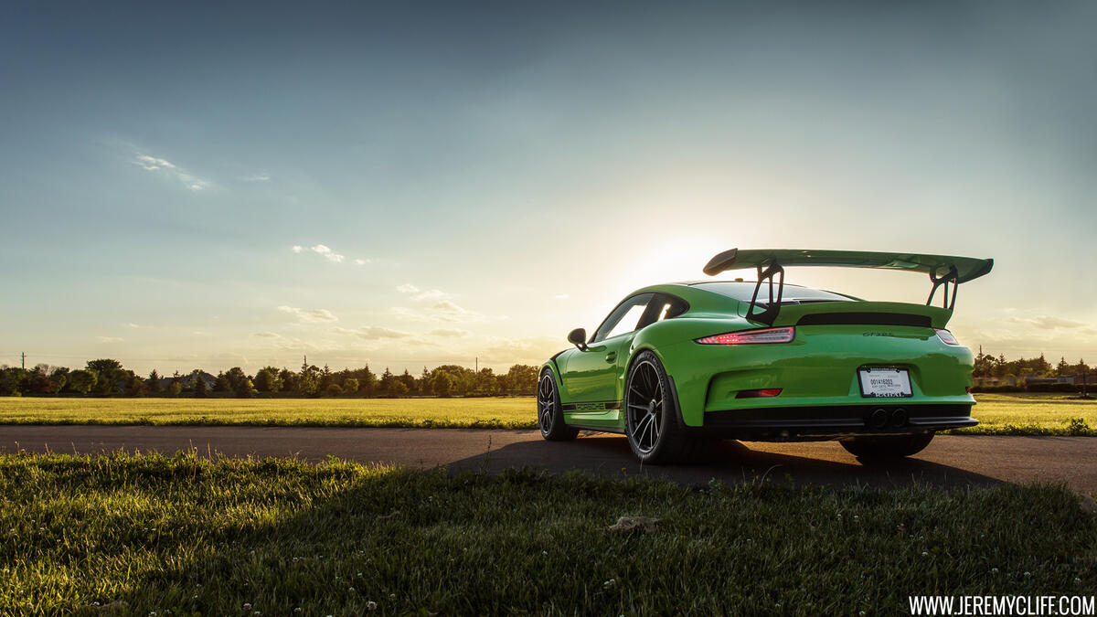 Porsche 911 in green with a big spoiler