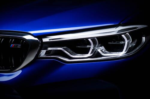BMW M5 headlights on blue bodywork
