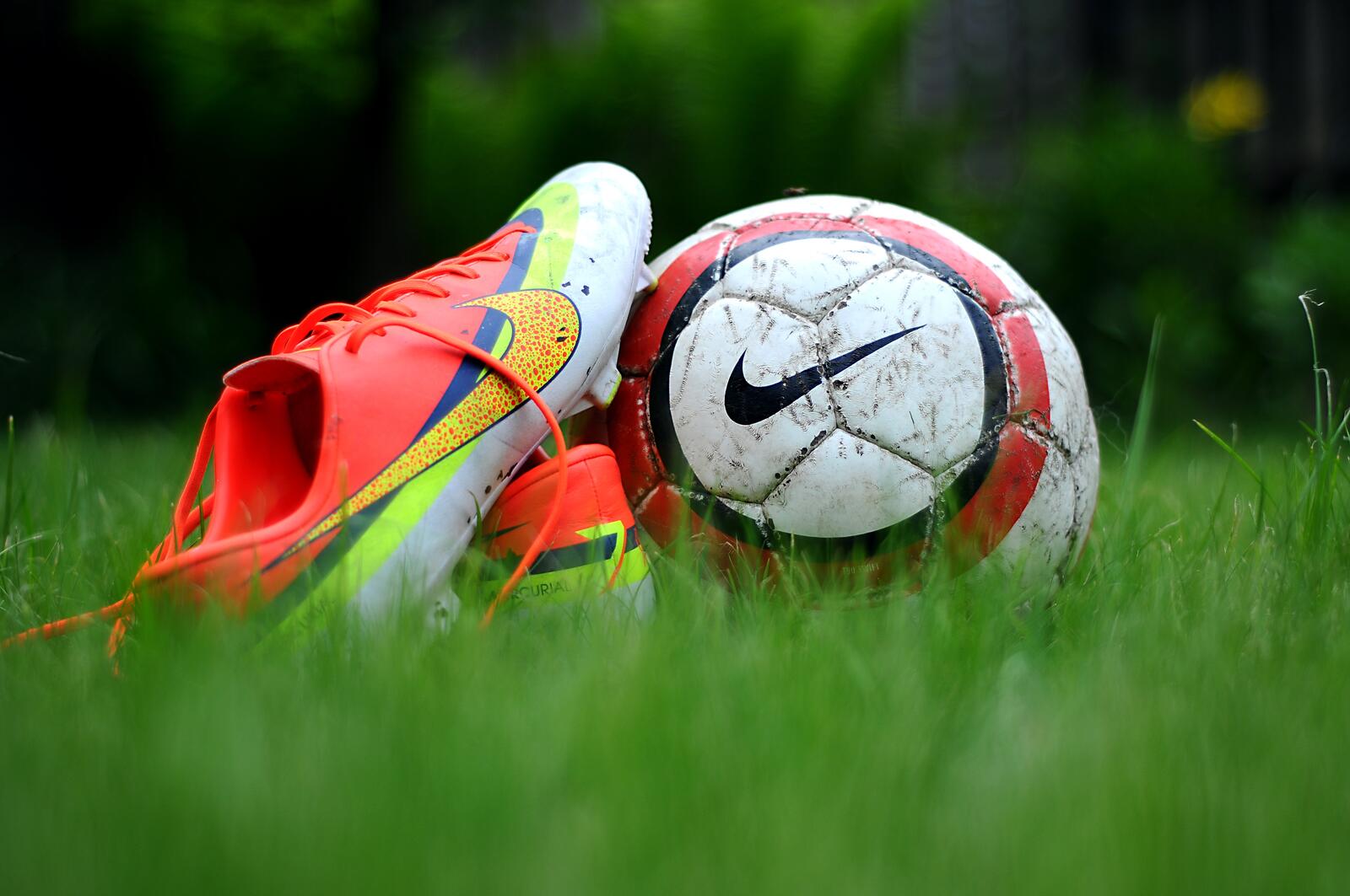 Free photo A soccer ball with cleats on a soccer field