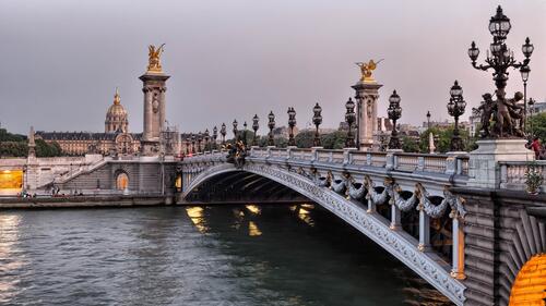 An ancient bridge over a river in Paris