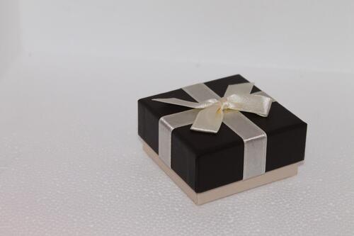 Black gift box with white bow