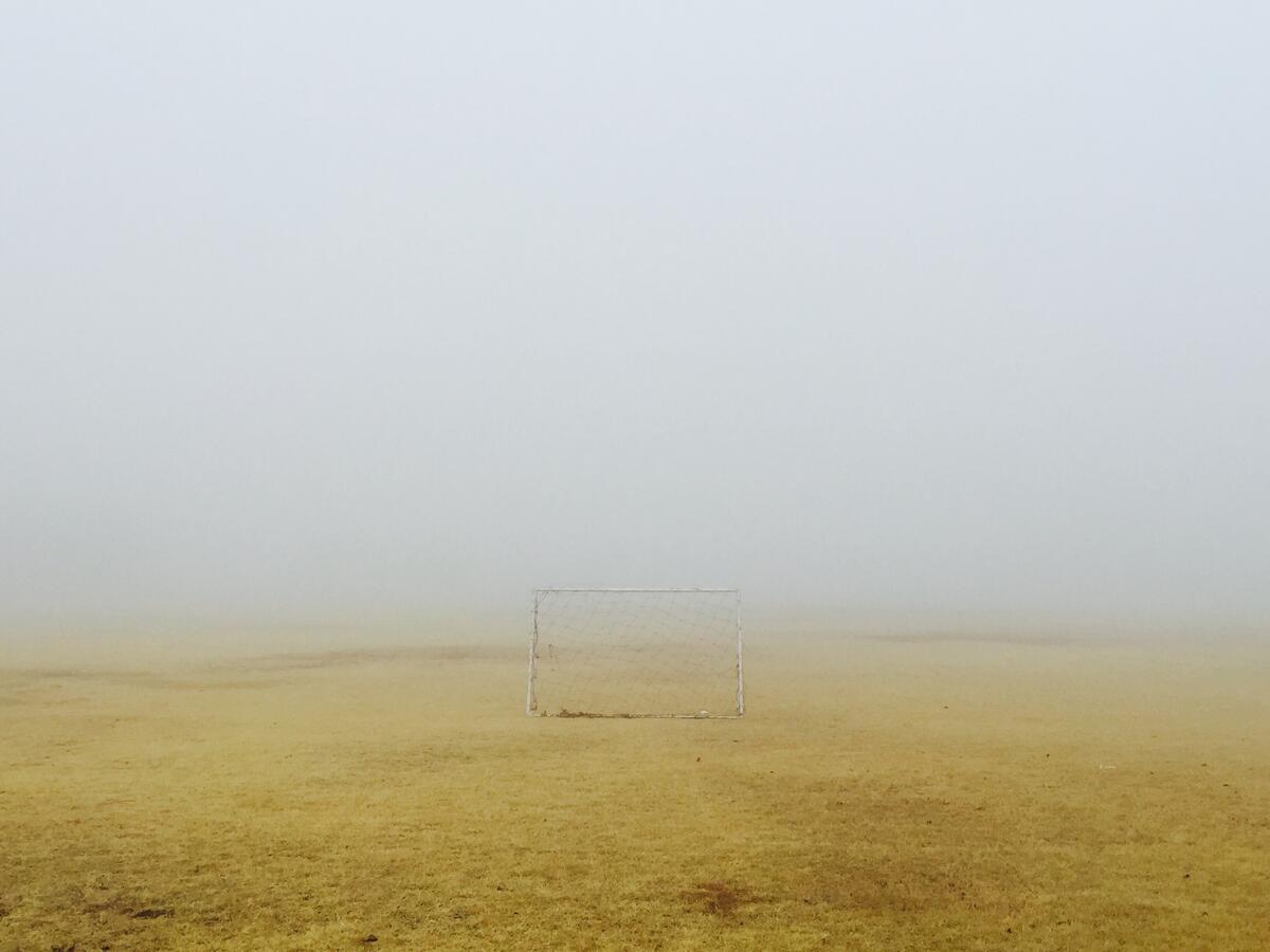 Soccer goals in the countryside in the fog