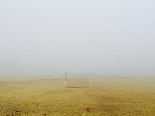 Soccer goals in the countryside in the fog