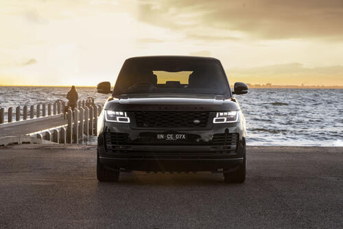 A black 2021 Range Rover against the backdrop of the sea