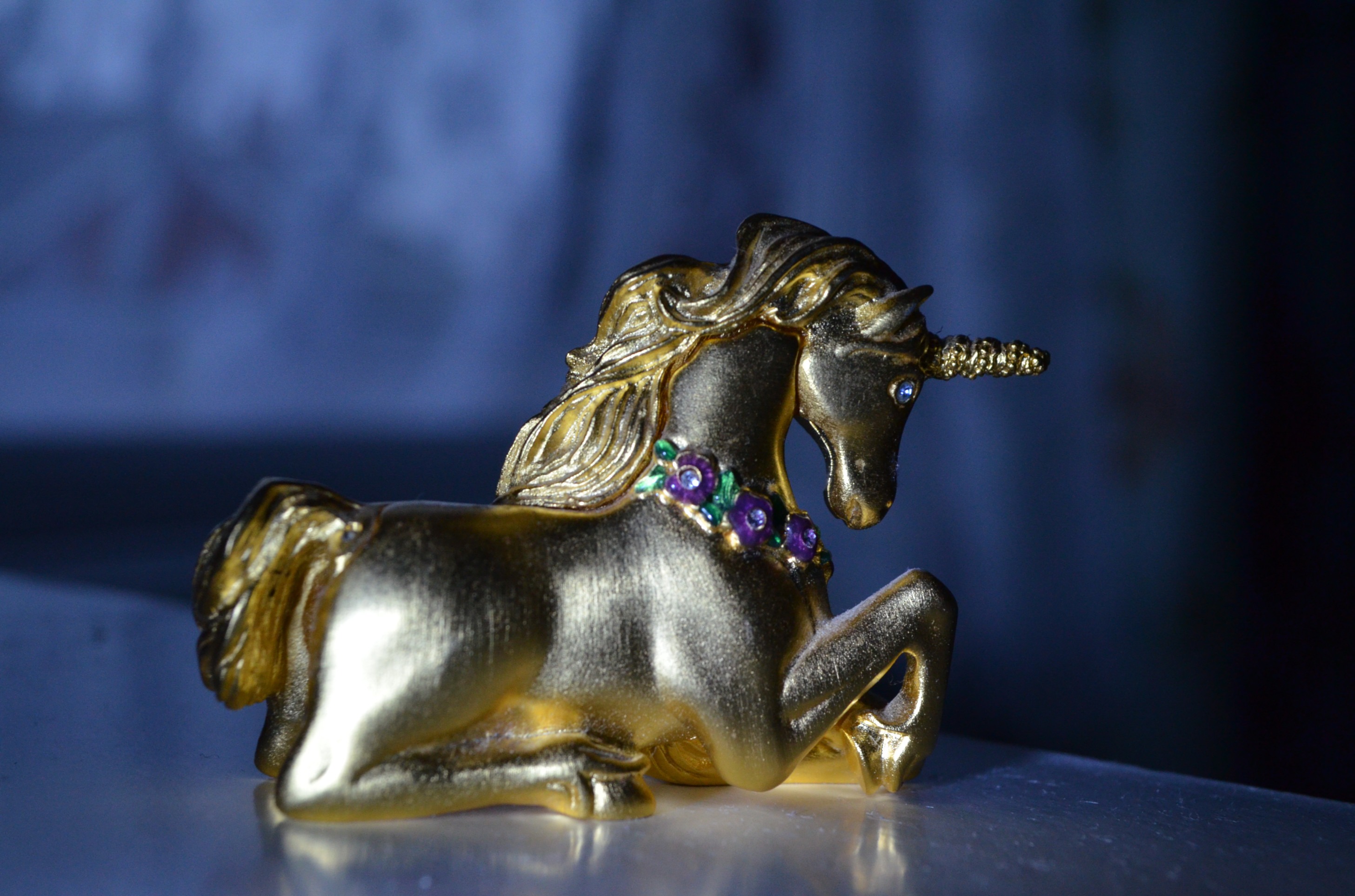 Free photo Gold Unicorn figurine