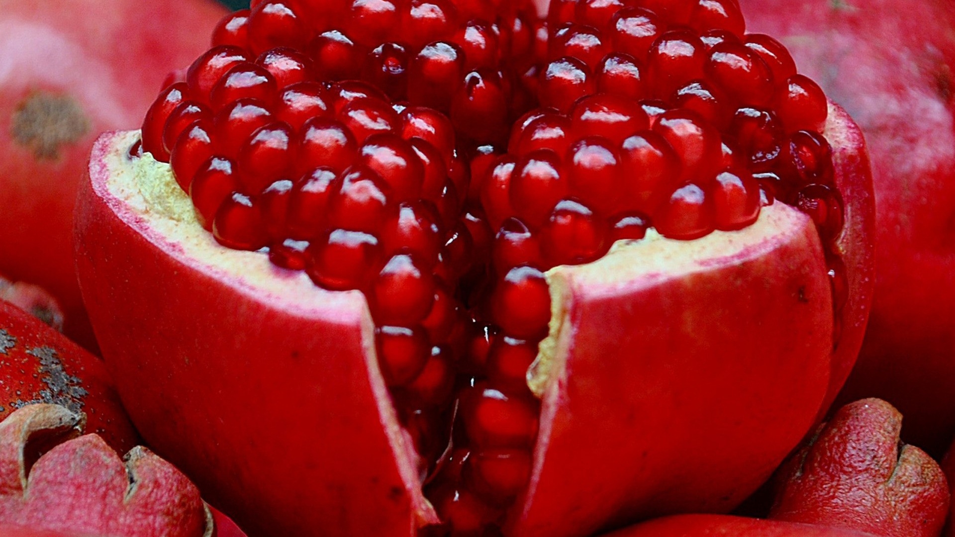 A pomegranate broken into pieces