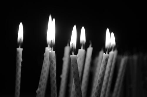 Black and white photo with lit candles