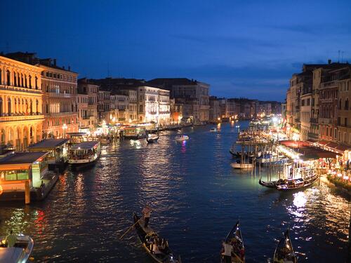 A nighttime water canal in Italy