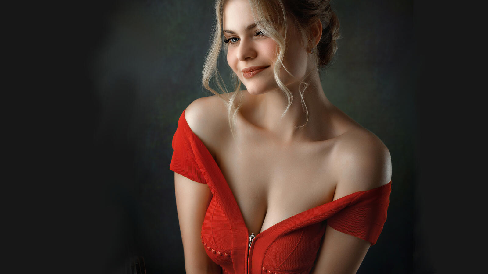 Free photo Busty blonde young girl in a red dress