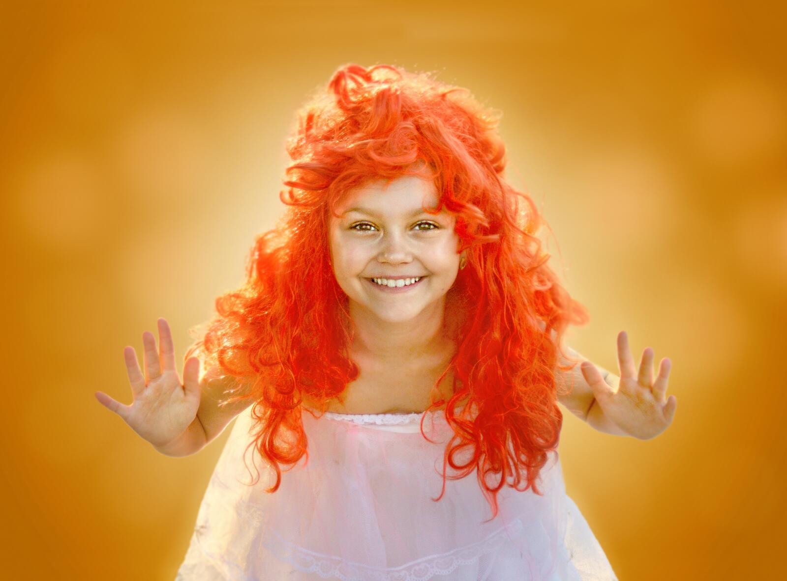 Free photo A little girl with red hair