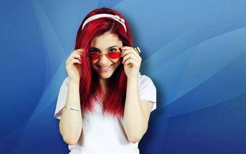 Ariana Grande in red sunglasses.