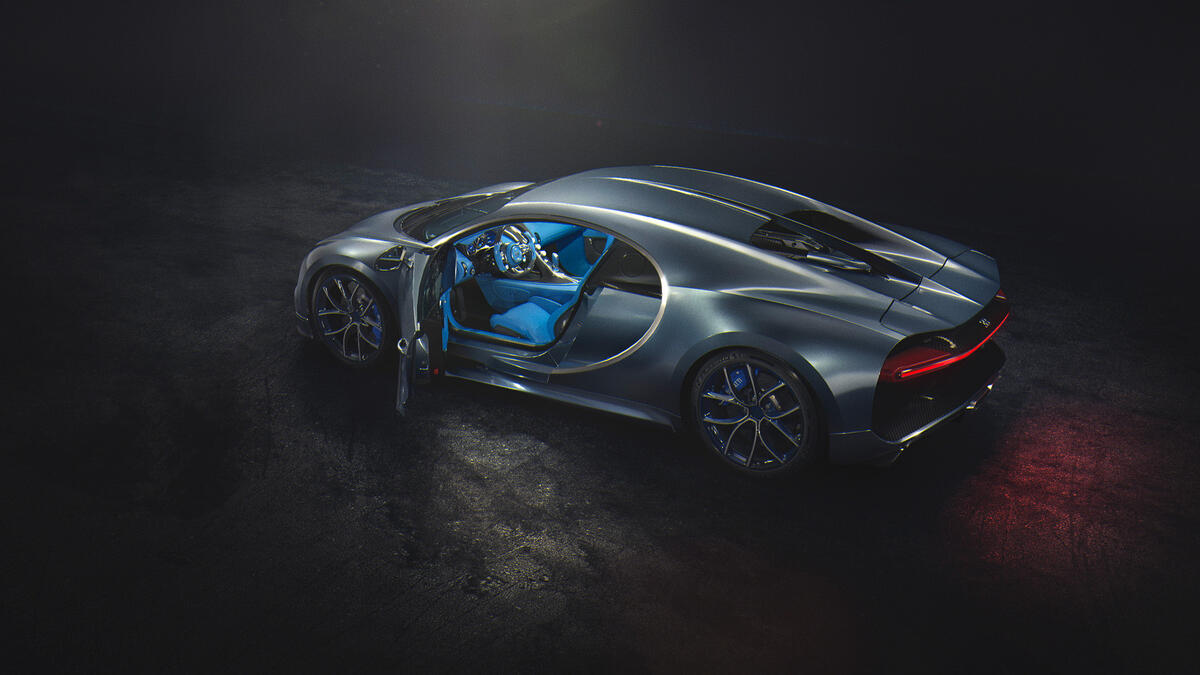 Grey Bugatti Chiron in the dark with blue interior