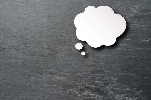 A white cloud of thought on a gray background