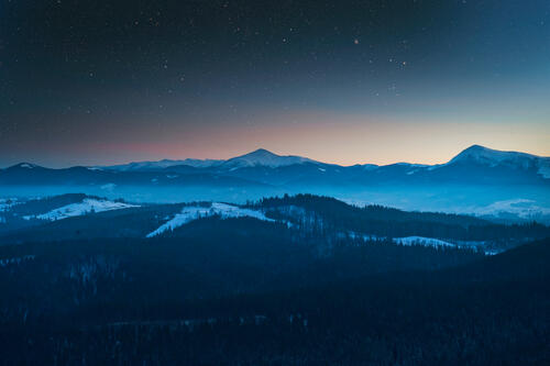 Snowy mountains at dusk