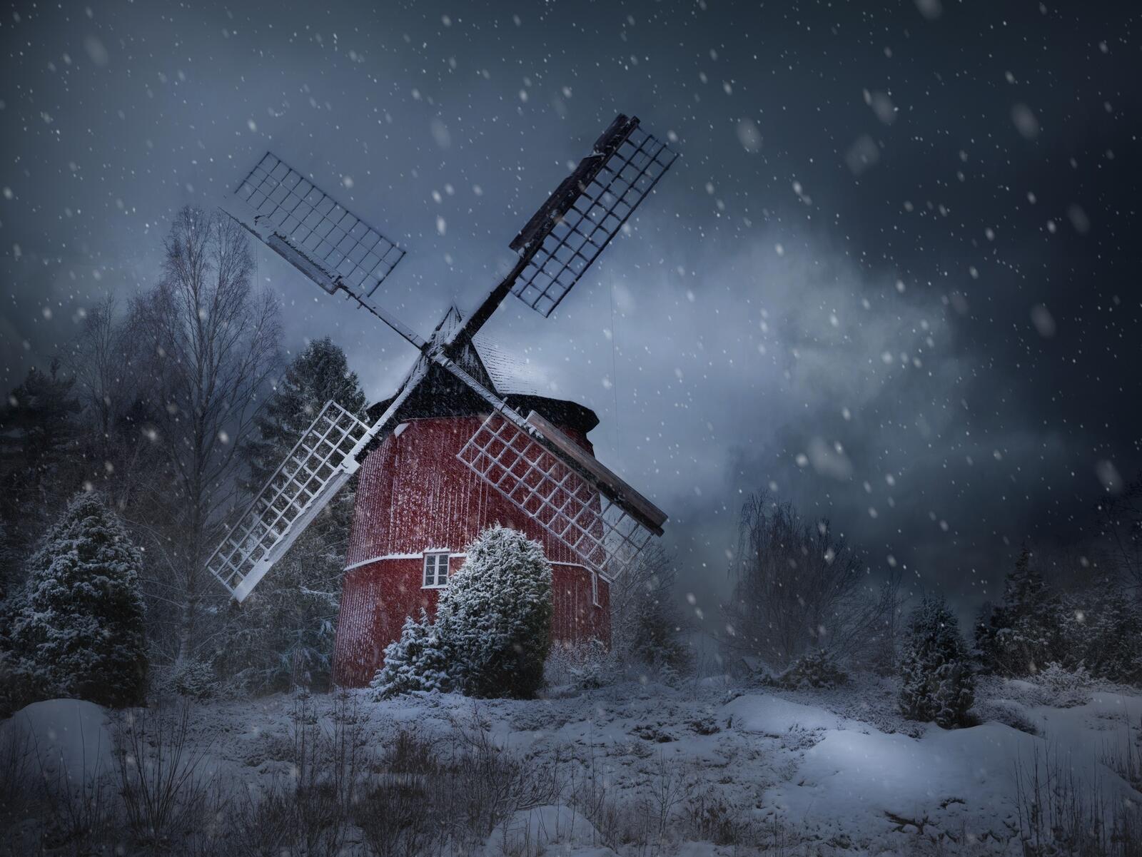 Бесплатное фото Красная мельница морозной ночью