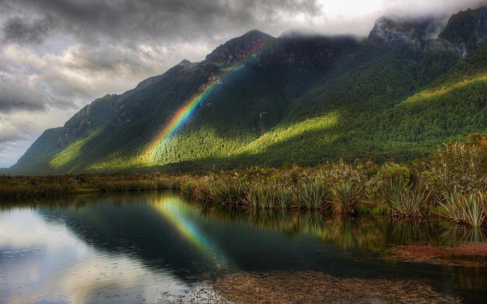 Free photo Rainbows reflect on the hills