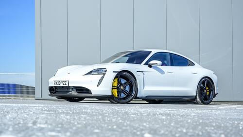 White porsche taycan surbo s with yellow calipers