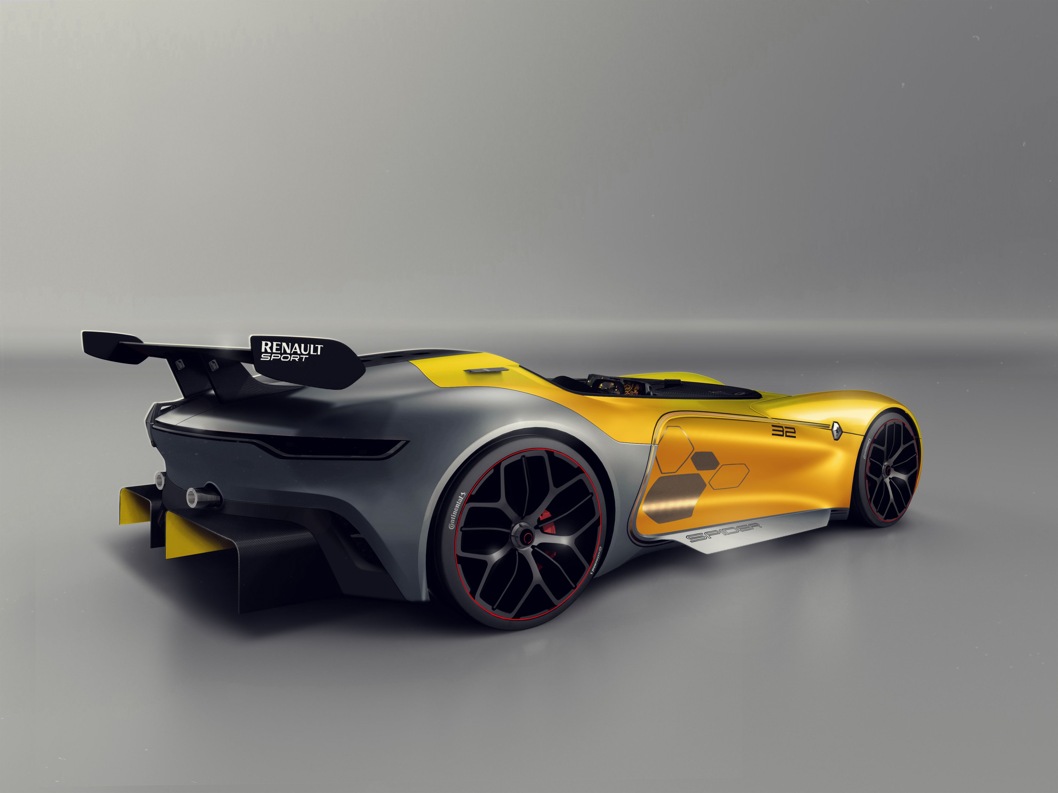 Renault yellow sports car rear view
