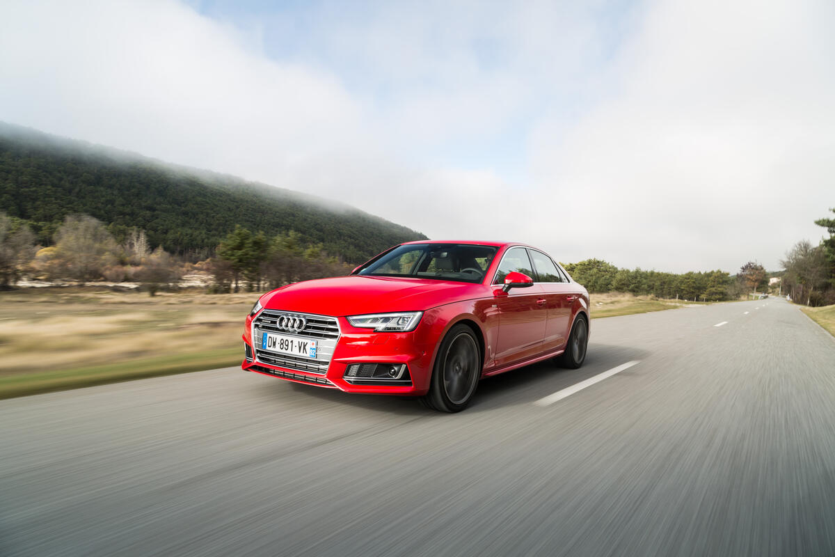 Wallpaper with red audi a4 quattro on the road
