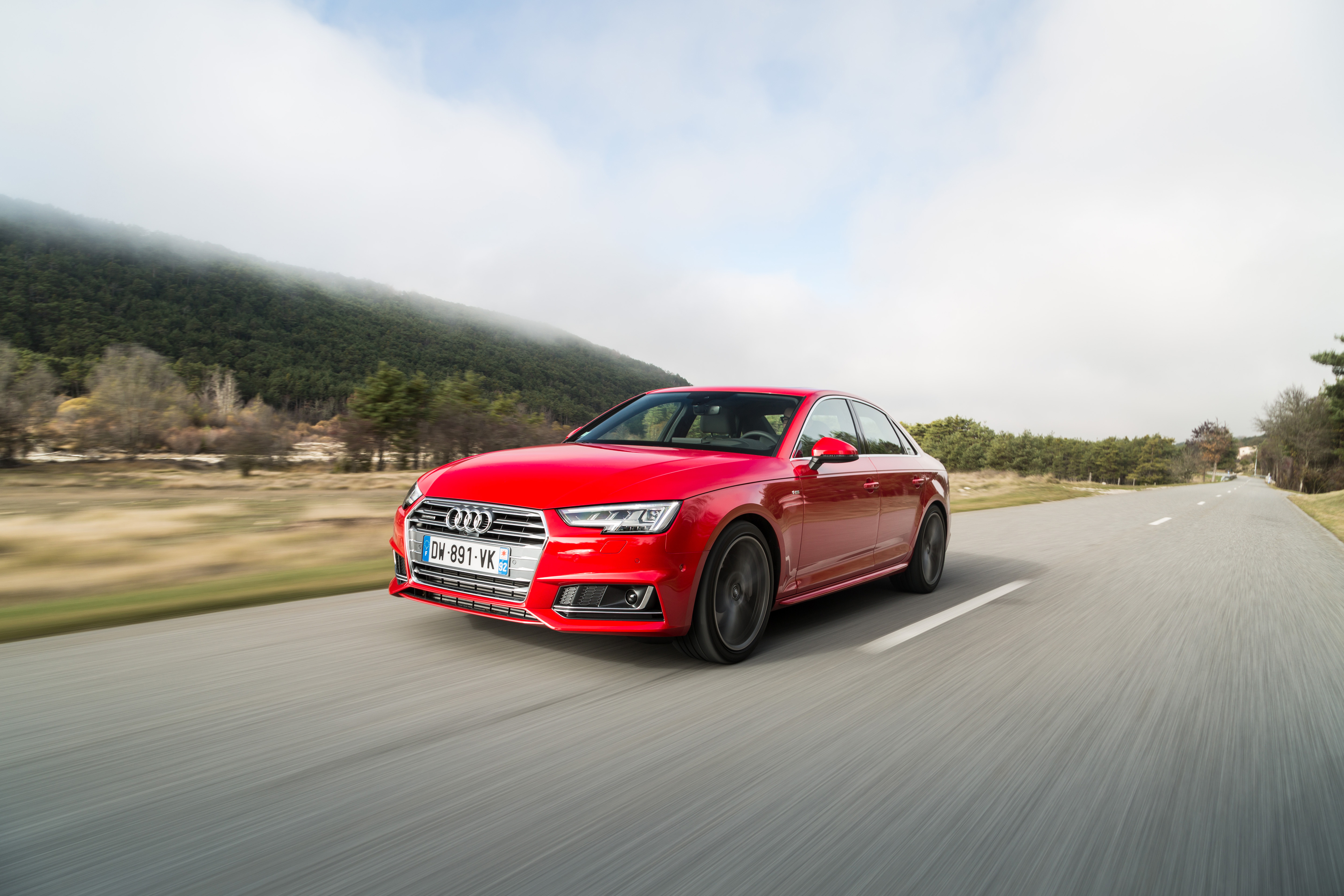 Free photo Wallpaper with red audi a4 quattro on the road