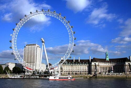 A Ferris wheel on a riverside in England