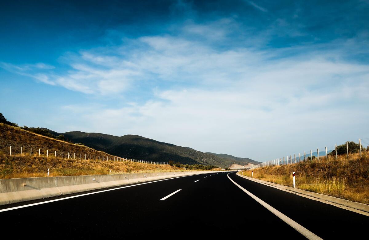 Black highway with white markings