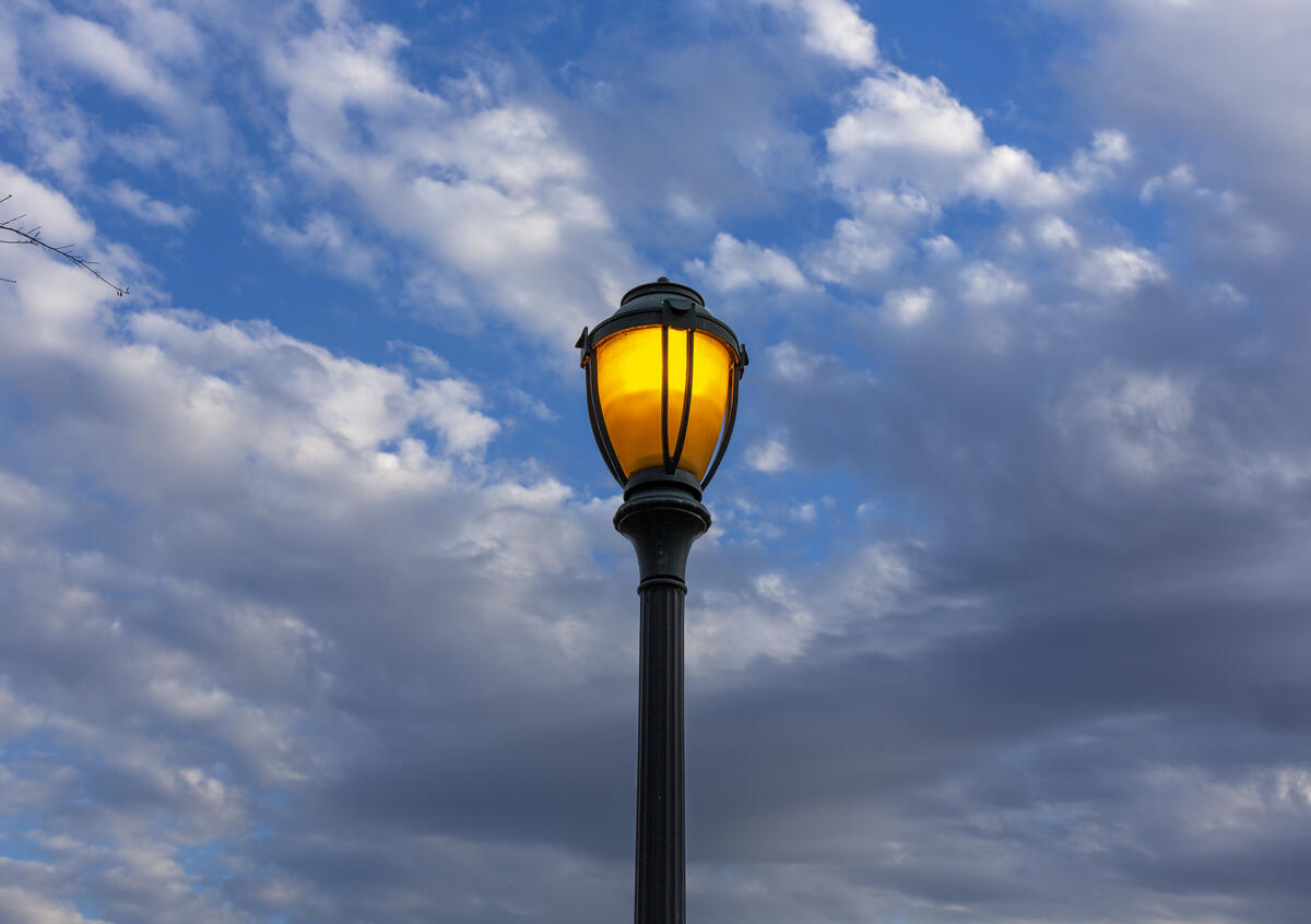 A street lamp in the background of the sky