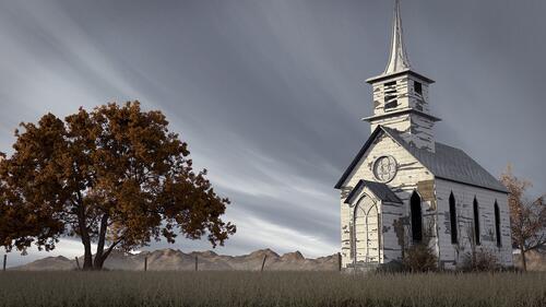 An old abandoned church with peeling white paint