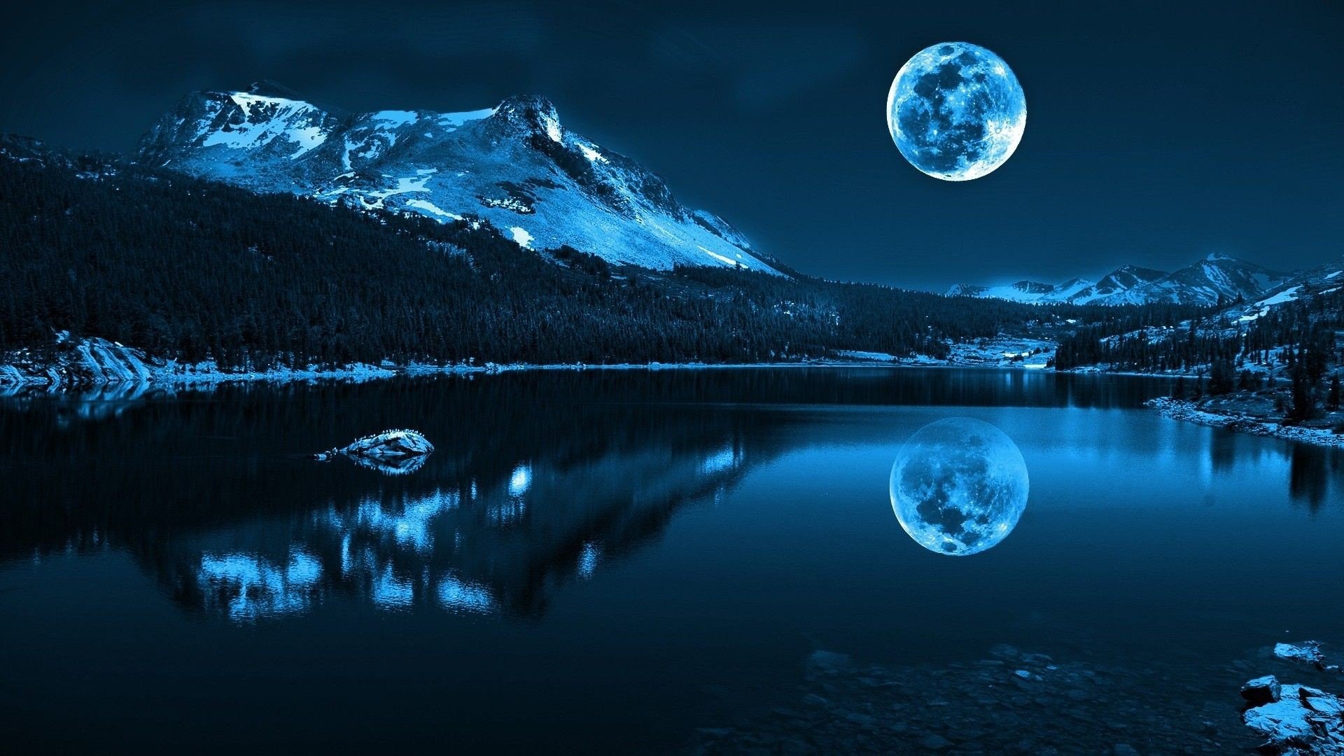 The big round moon is reflected in the lake