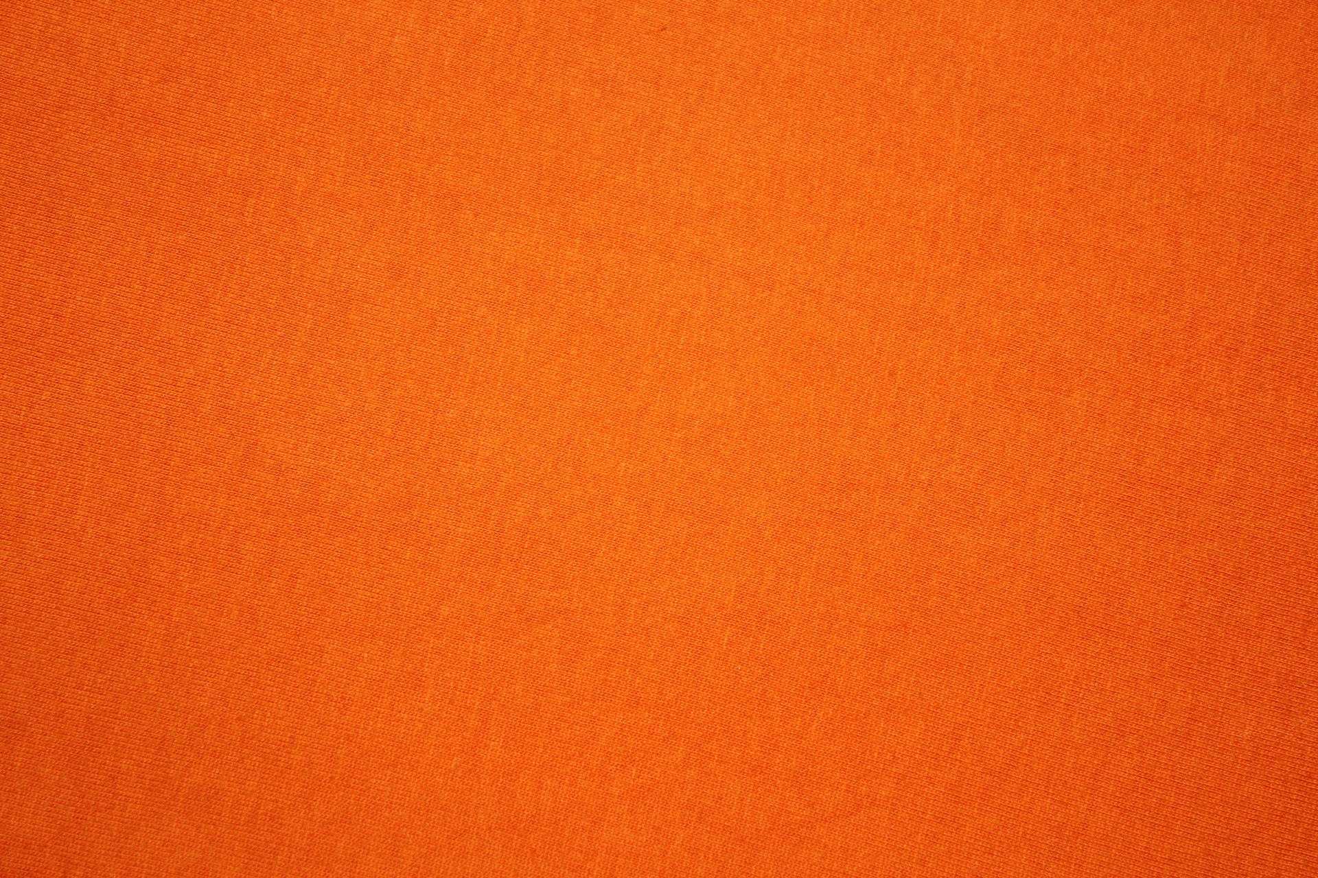Бесплатное фото Оранжевый текстильный фон