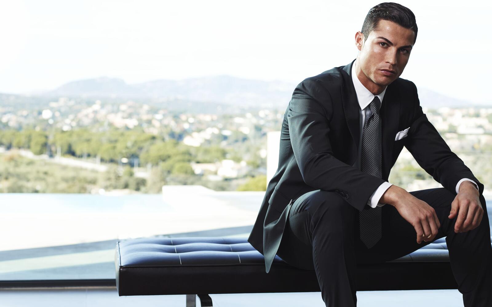 Free photo Cristiano Ronaldo in a black pinstripe suit.