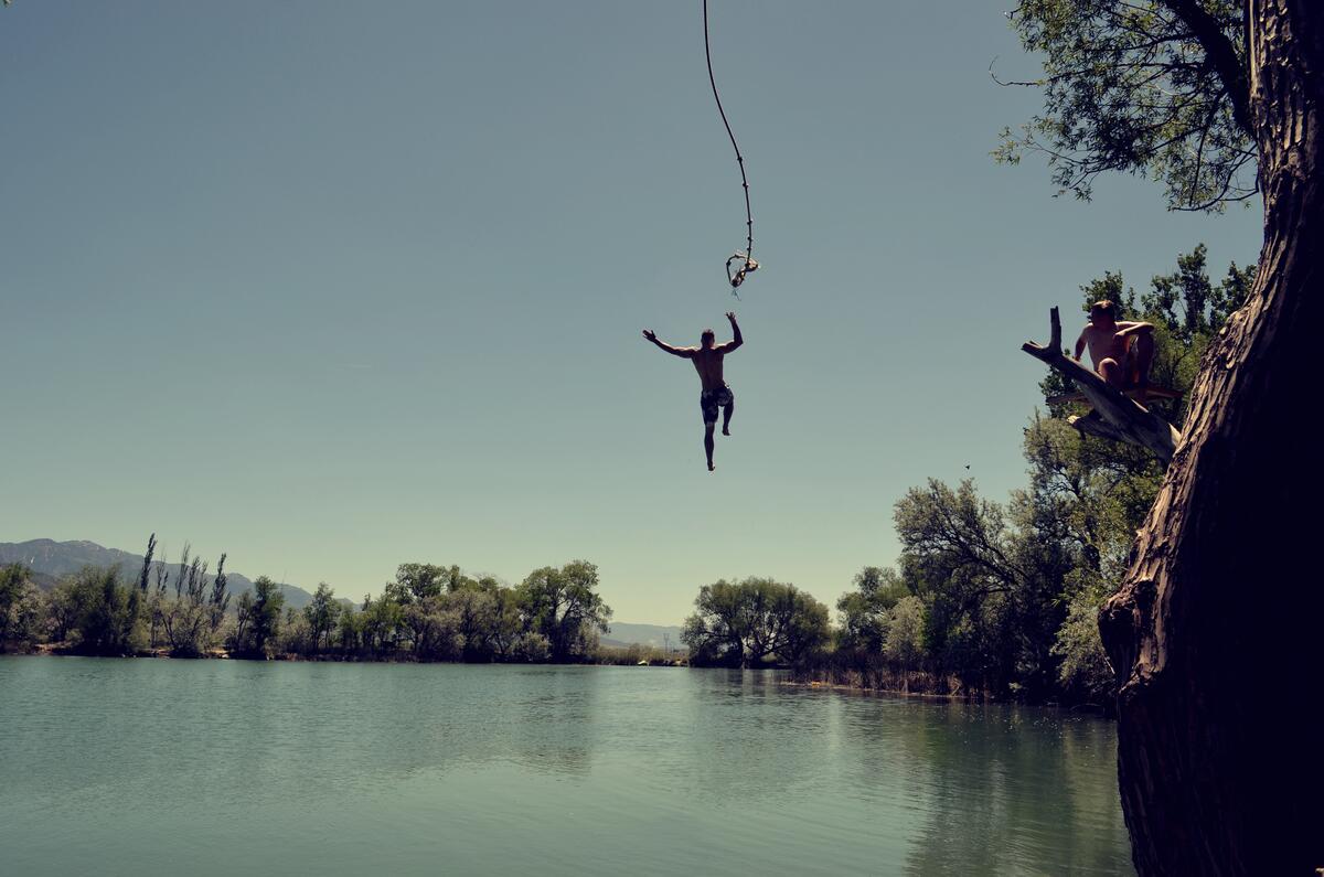 Bungee jumping into the water, active beach recreation