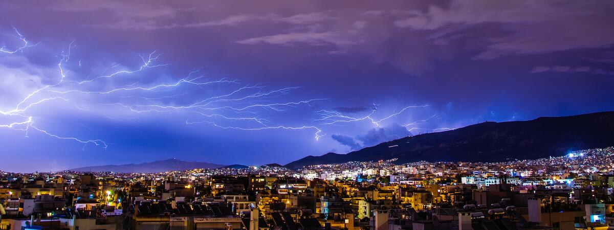 A thunderstorm over the city at night