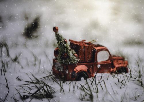 A car with a Christmas tree.