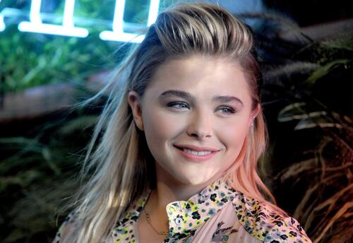 Chloe Grace Moretz with a smile on her face