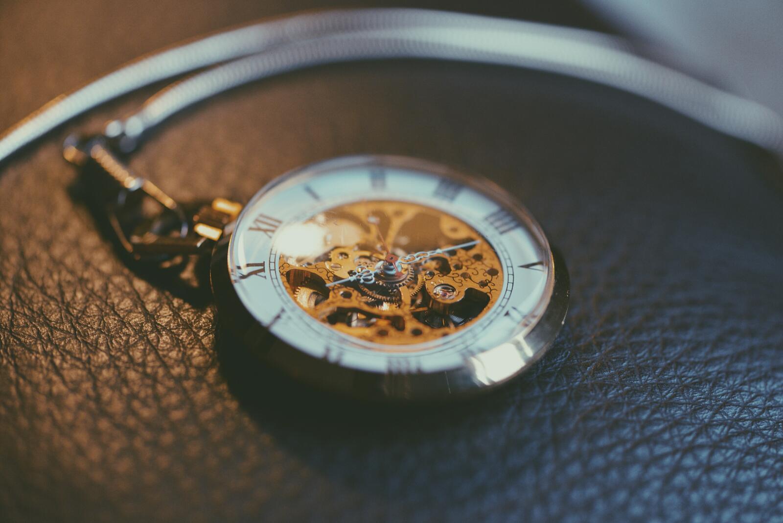Free photo Pocket watch with gold mechanical part