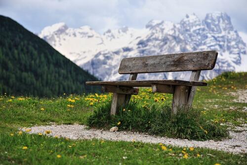 An old wooden bench in the mountains
