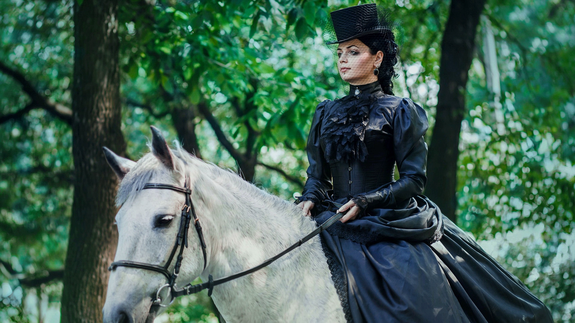 Model Katerina Baumgertner on horseback in the woods