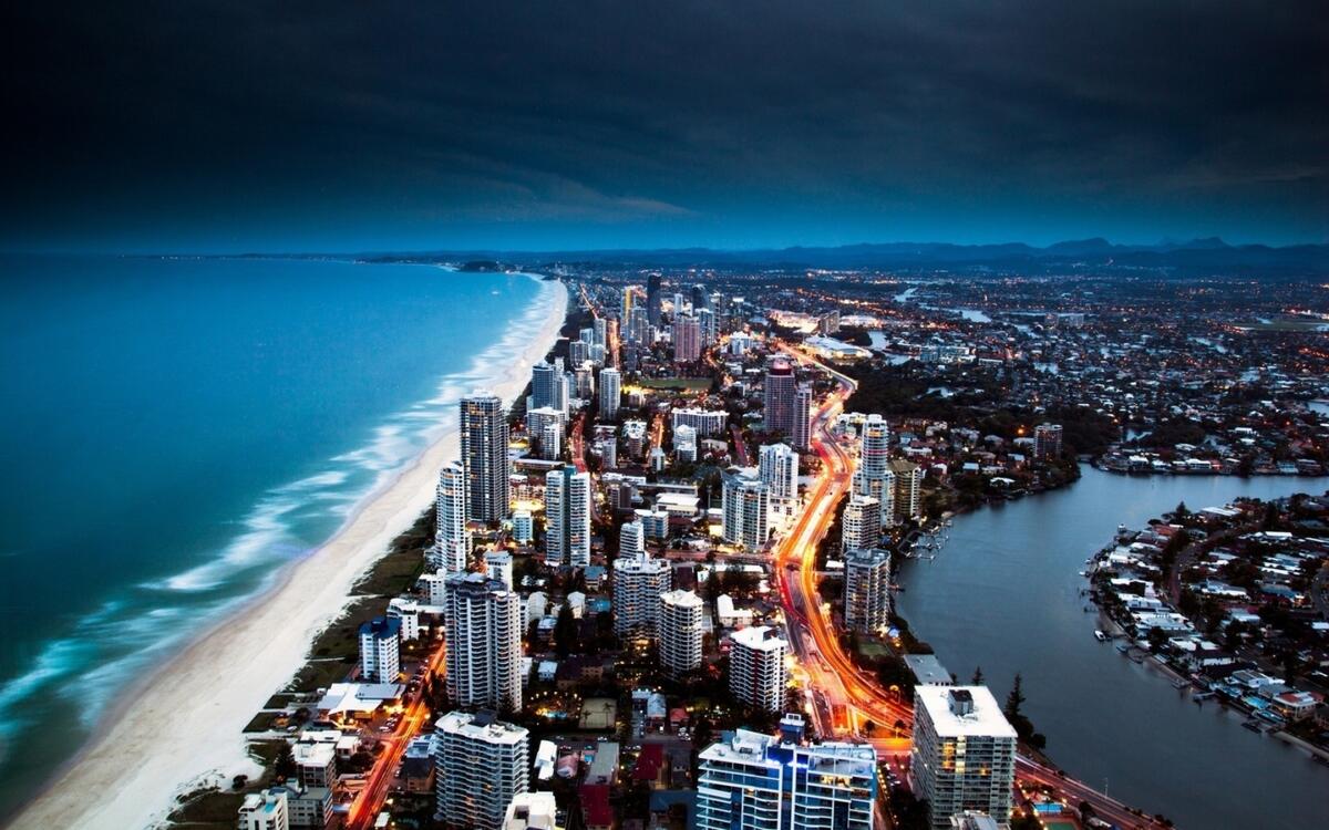 Modern city by the sea in the evening