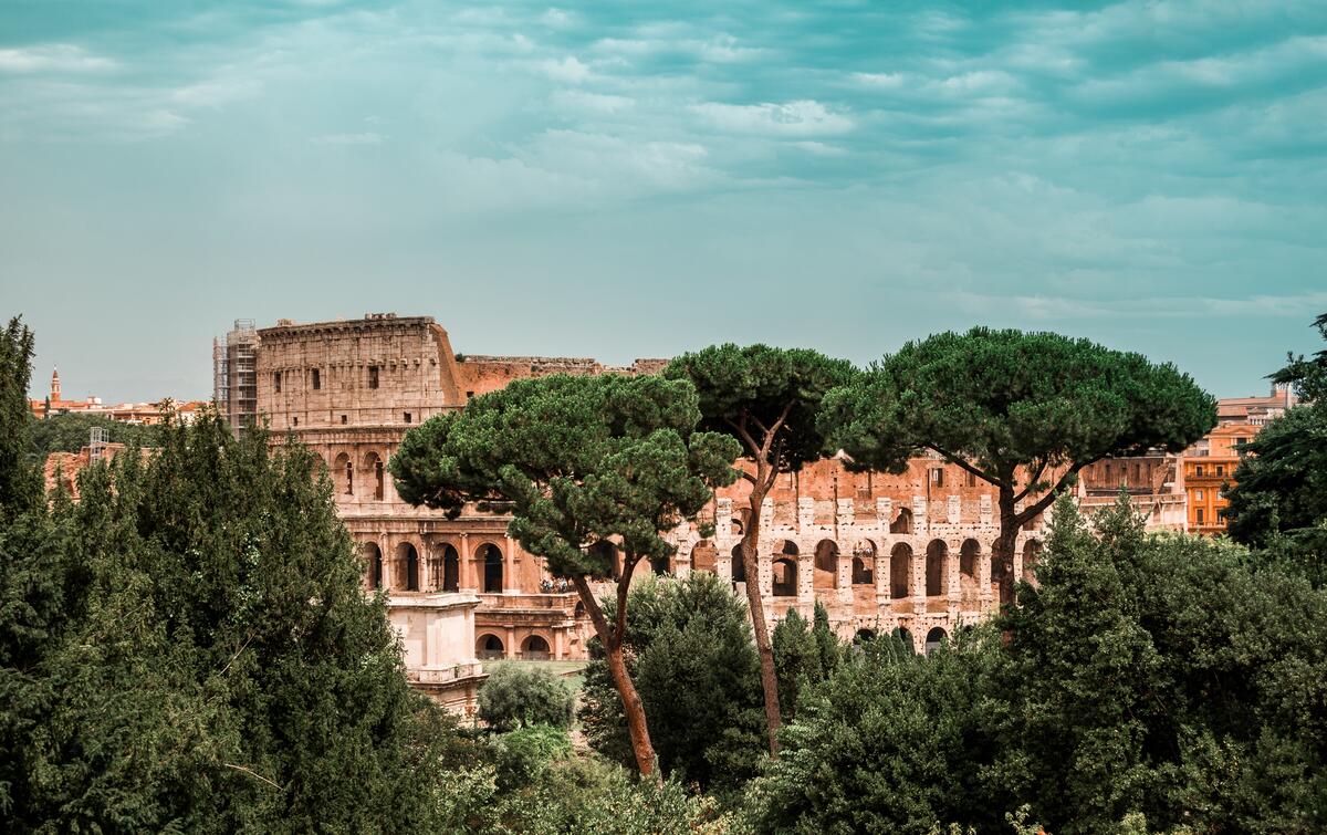 The Colosseum in Rome with green trees
