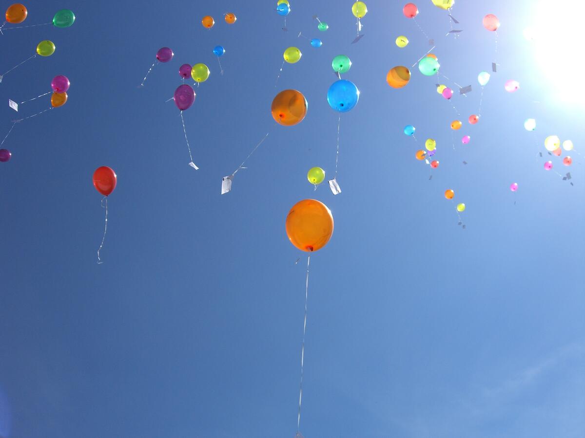 Helium balloons fly up to the sky