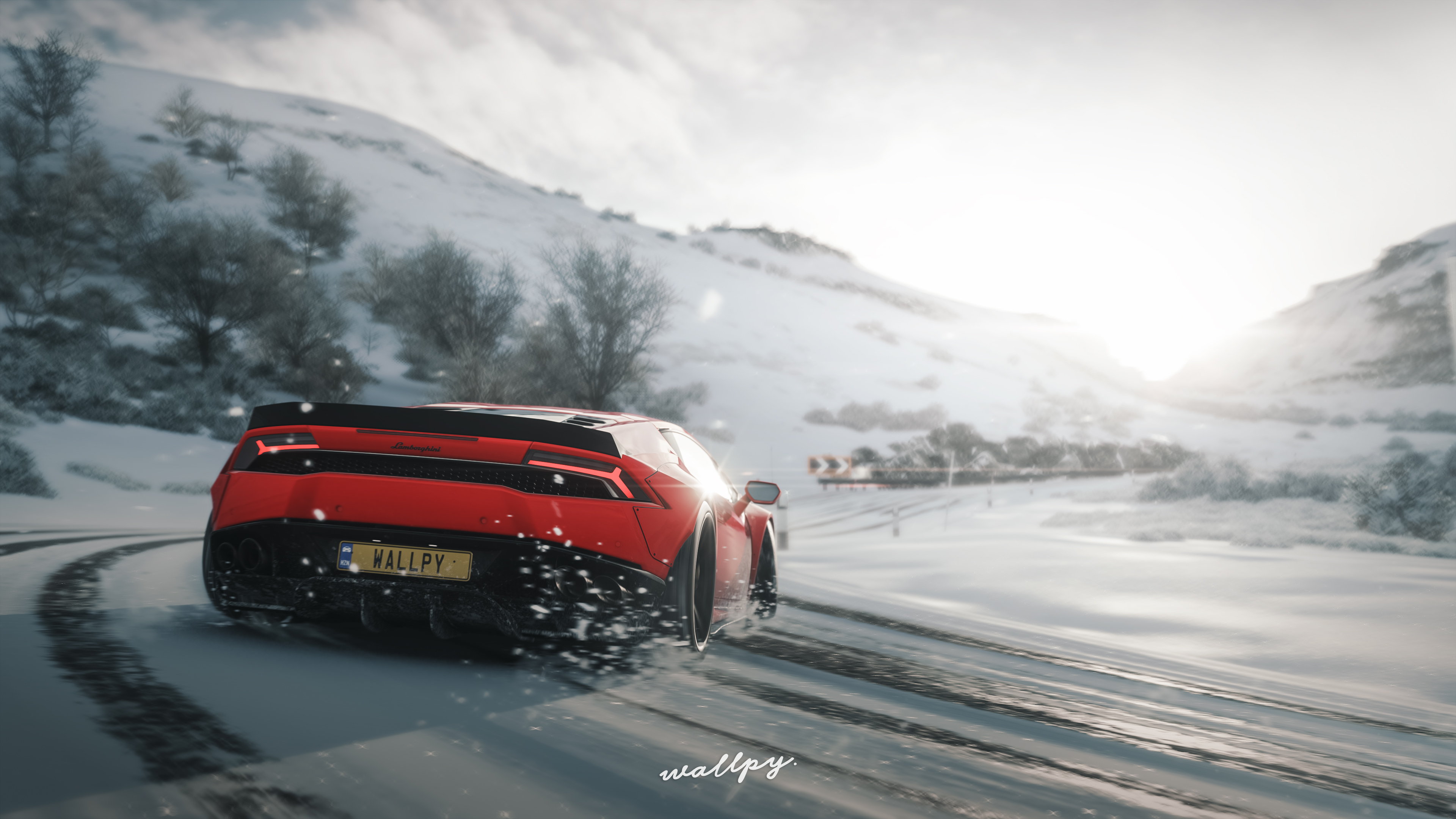 Red Lamborghini Huracan in a drift on a winter road