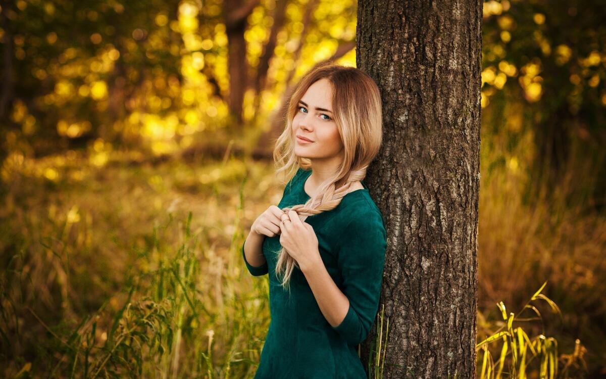 A beautiful girl in a green dress