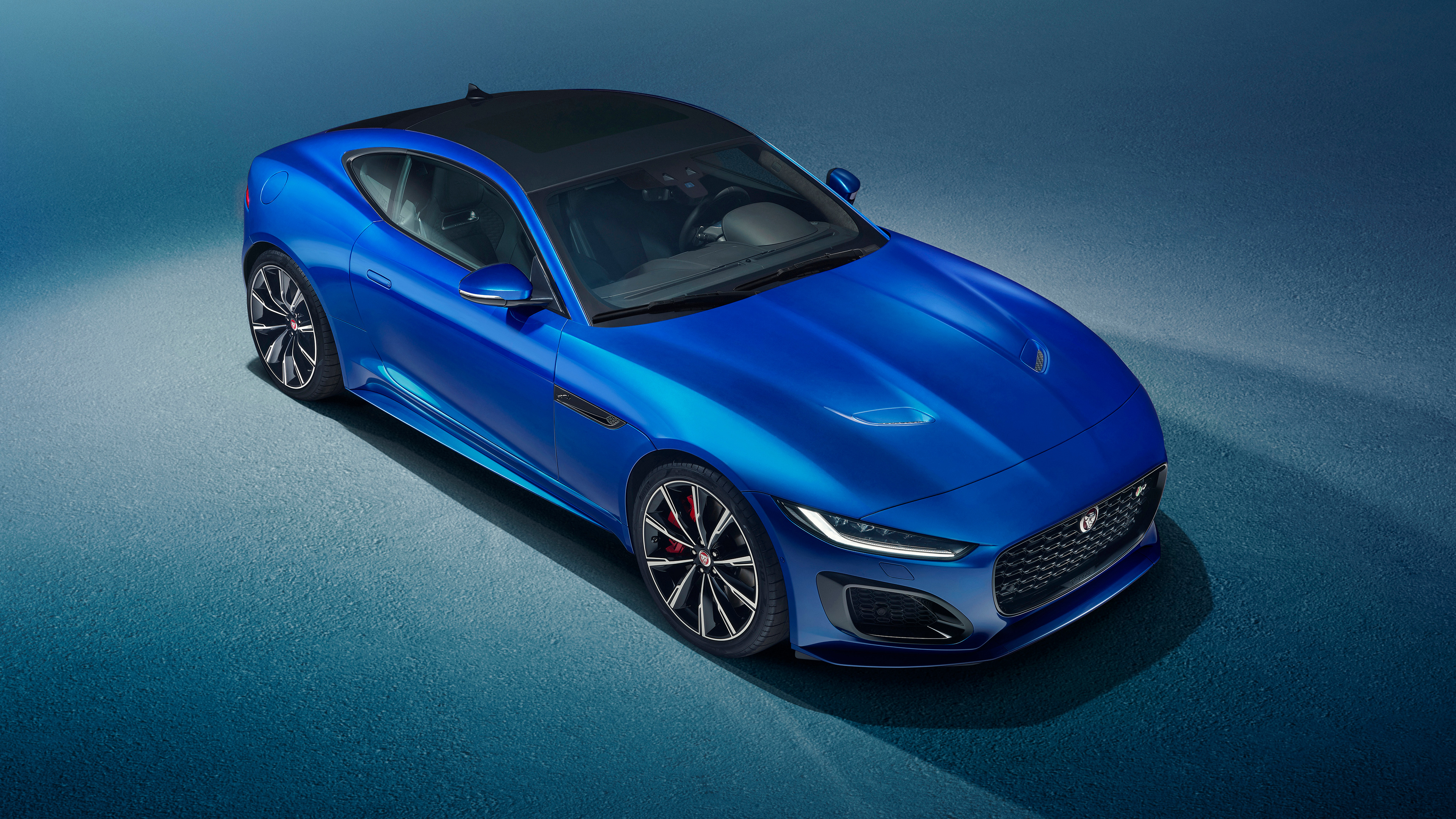 Jaguar f-type r in blue photographed from above