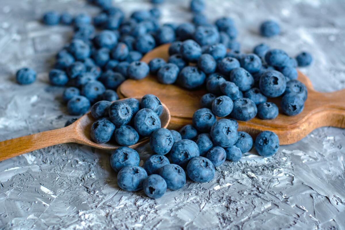 A picture of blueberries scattered across the table.